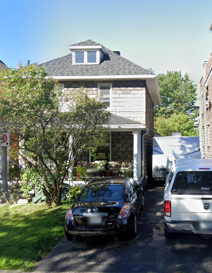 a house with a car parked in front of it